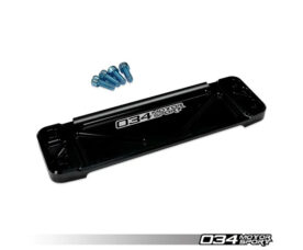 Black rectangular automotive mounting plate with four blue screws nearby; 034Motorsport branding visible.