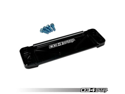 Black rectangular automotive mounting plate with four blue screws nearby; 034Motorsport branding visible.