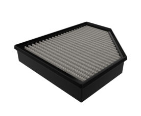 Rectangular air filter with pleated grey media inside a black frame.