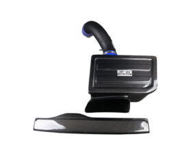 Carbon fiber car air intake kit with curved intake tube, rectangular housing, and a matching carbon plank piece