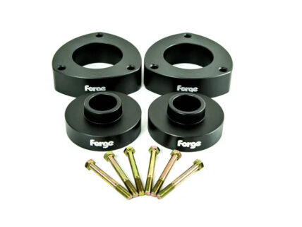 Wheel spacer kit with four black spacers and six bolts on a white background.