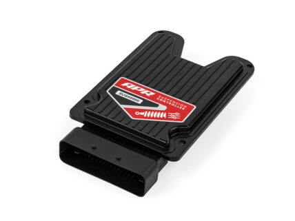 Black automotive suspension controller module with a red label and a multi-pin connector at one end, used to adjust suspension settings.