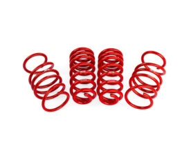 Set of red coil springs standing upright on a white background, arranged in a row and forming a decorative display.